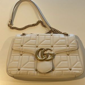 Gucci cream color with gold studding and large gold GG excellent condition
